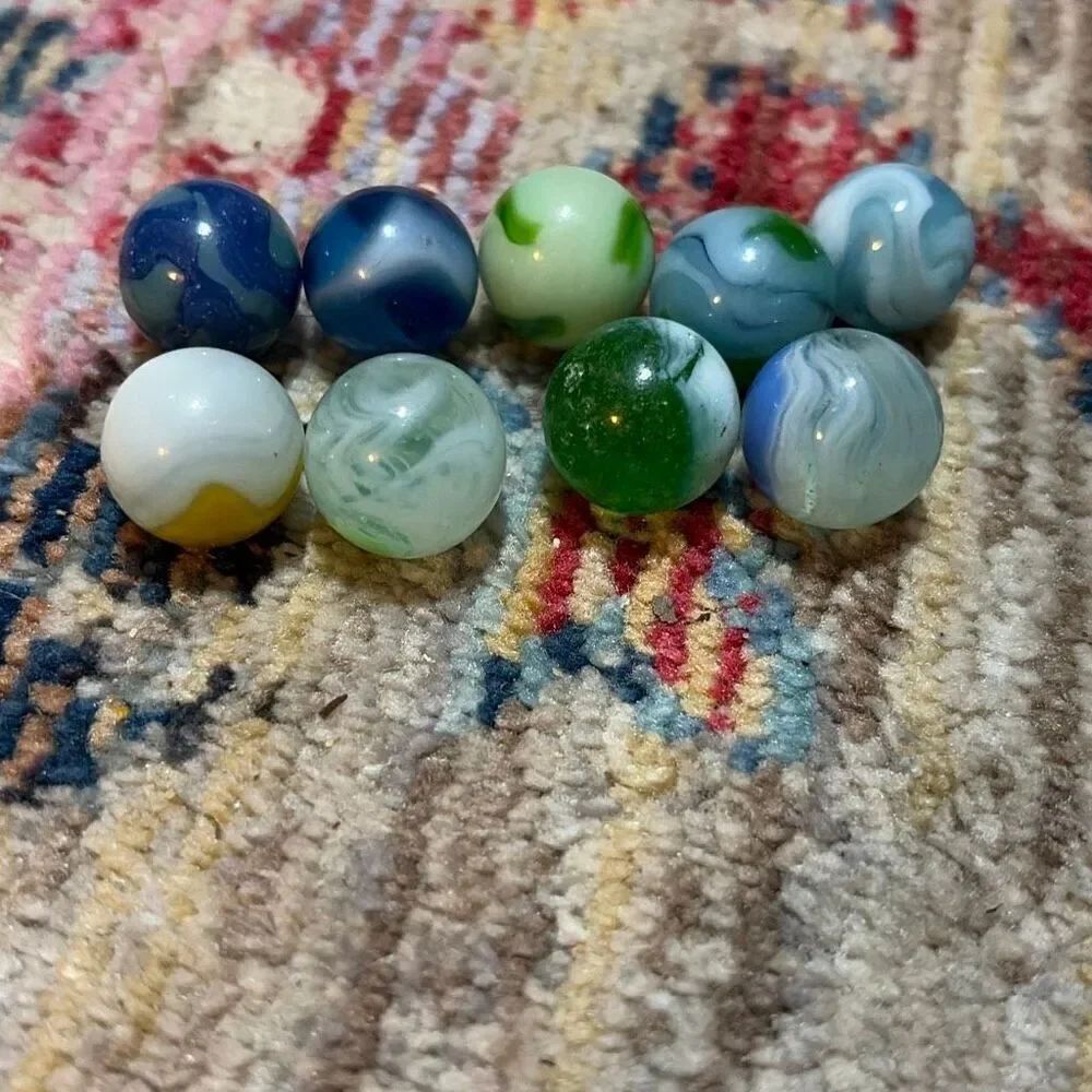 Vintage multicolor marbles, including one with a heart shape one that looks like